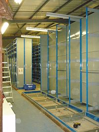 Old archive roller shelving being dismantled before being rebuilt at Cranfield